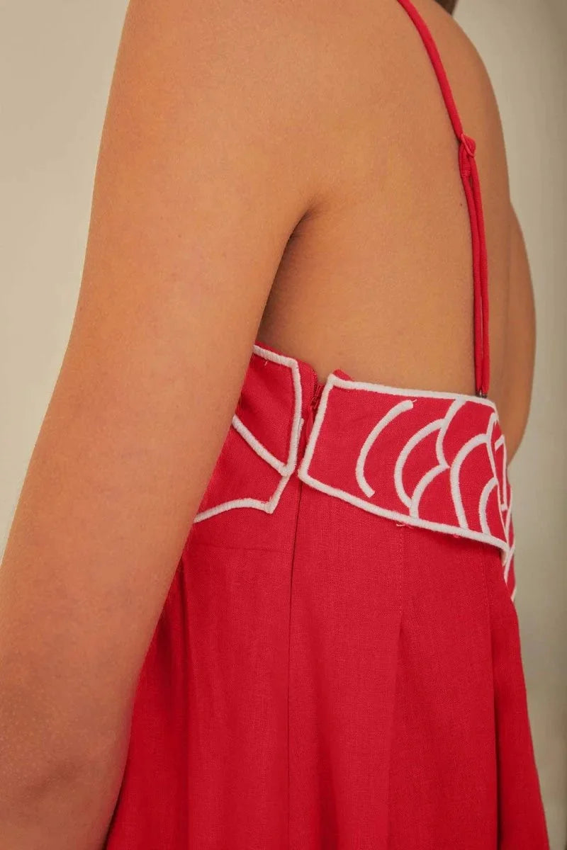 Red sleeveless maxi dress with intricate embroidered detailing for Muslim women.