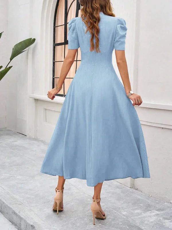 "Puff sleeve V-neck midi dress in flowy fabric, perfect for casual or dressy occasions."