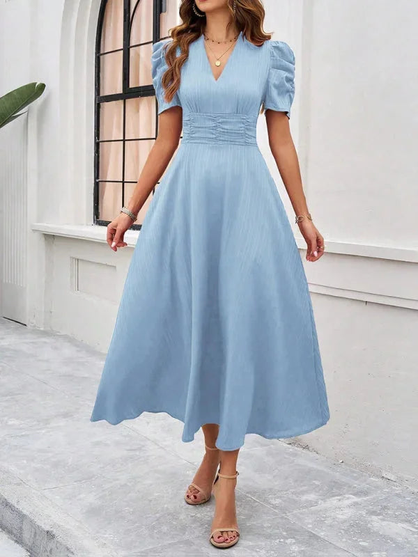 "Puff sleeve V-neck flowy midi dress in soft flowing fabric, perfect for casual chic style."