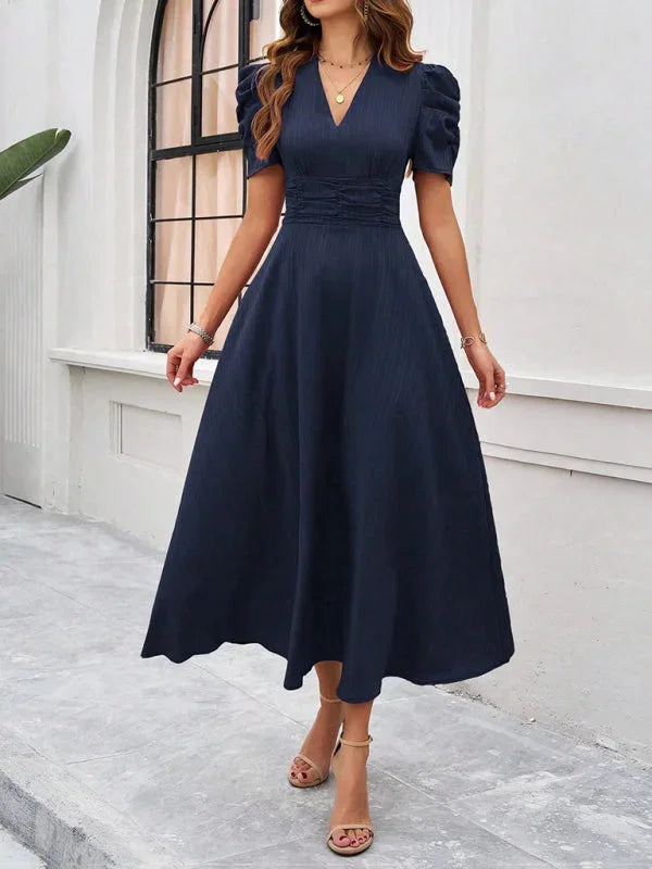 Navy blue puff sleeve V-neck flowy midi dress in crepe fabric with floral print.