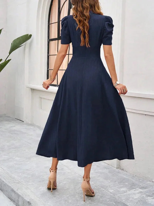 "Puff sleeve V-neck midi dress with flowy silhouette, perfect for all occasions. Made of breathable and comfortable fabric."