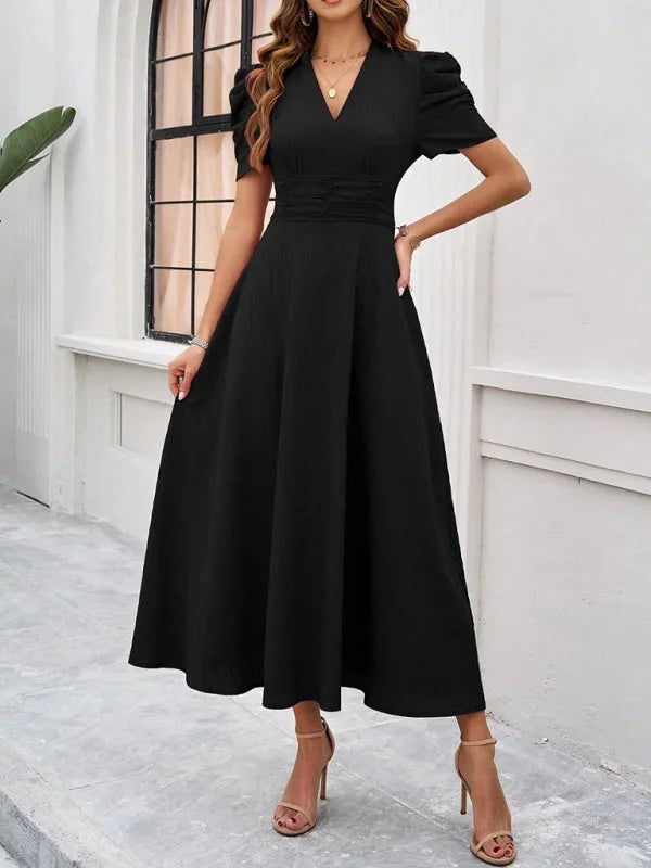 V-neck flowy midi dress with puff sleeves in a lightweight chiffon fabric, perfect for a casual yet elegant look.