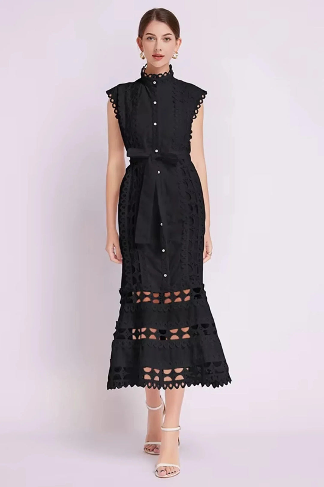 Sleeveless lace midi dress with belted waist in a refined design for a stylish look.