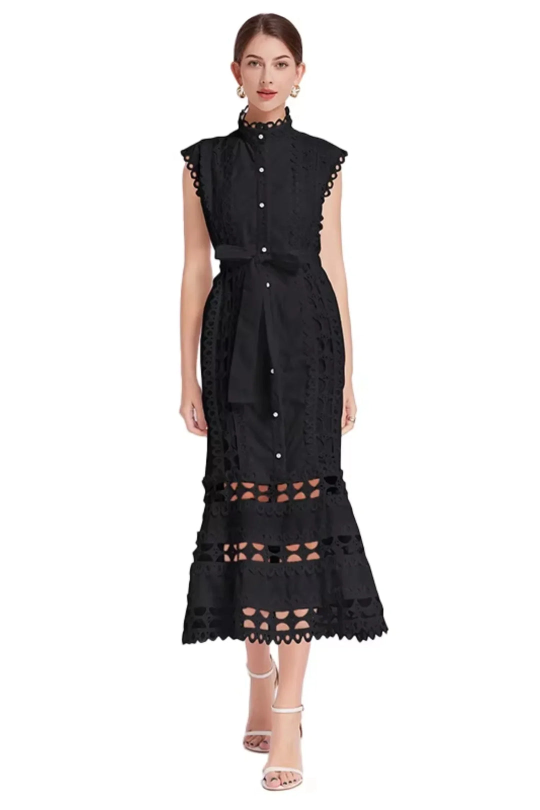 Black lace midi dress with belted waist, sleeveless design. Feminine and elegant piece for special occasions.