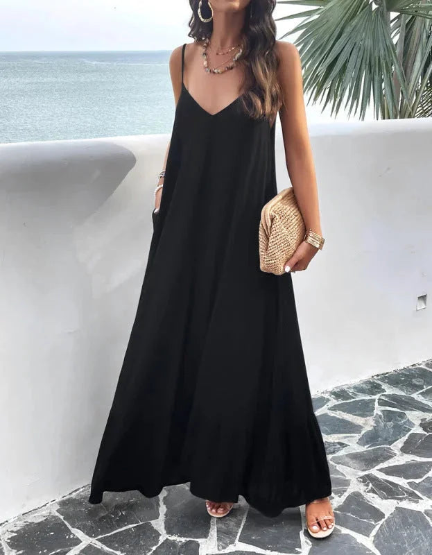 "Black sleeveless maxi dress with ruffle hem, perfect for any occasion. Features a lightweight and flowy fabric."