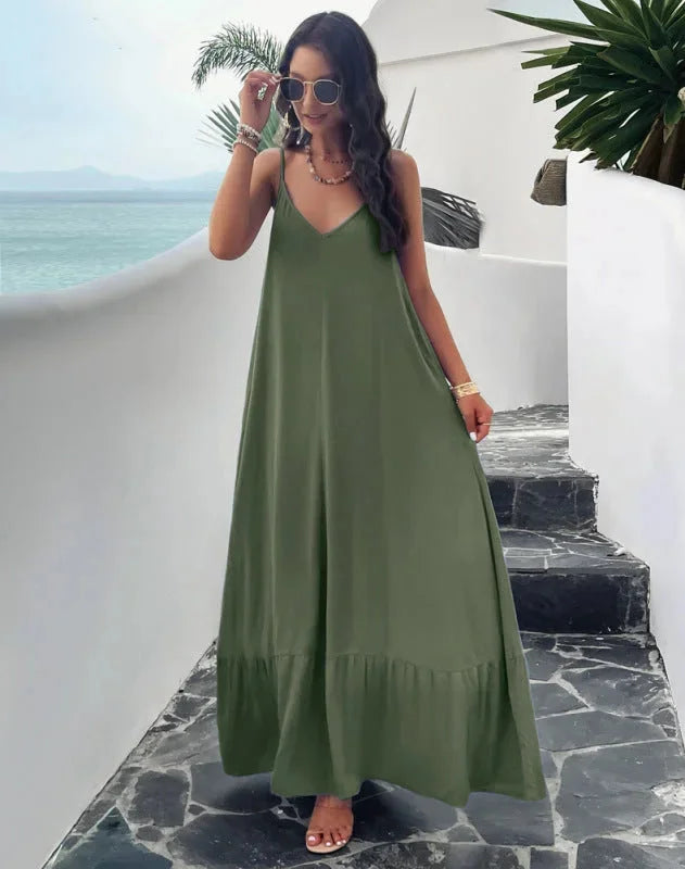 "Green sleeveless maxi dress with ruffle hem, perfect for summer. Made from lightweight fabric with a flattering silhouette."