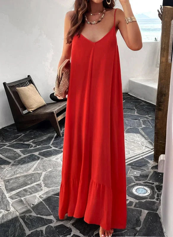 Red maxi dress with ruffle hem and sleeveless design. Made from lightweight, flowy fabric perfect for casual or formal…