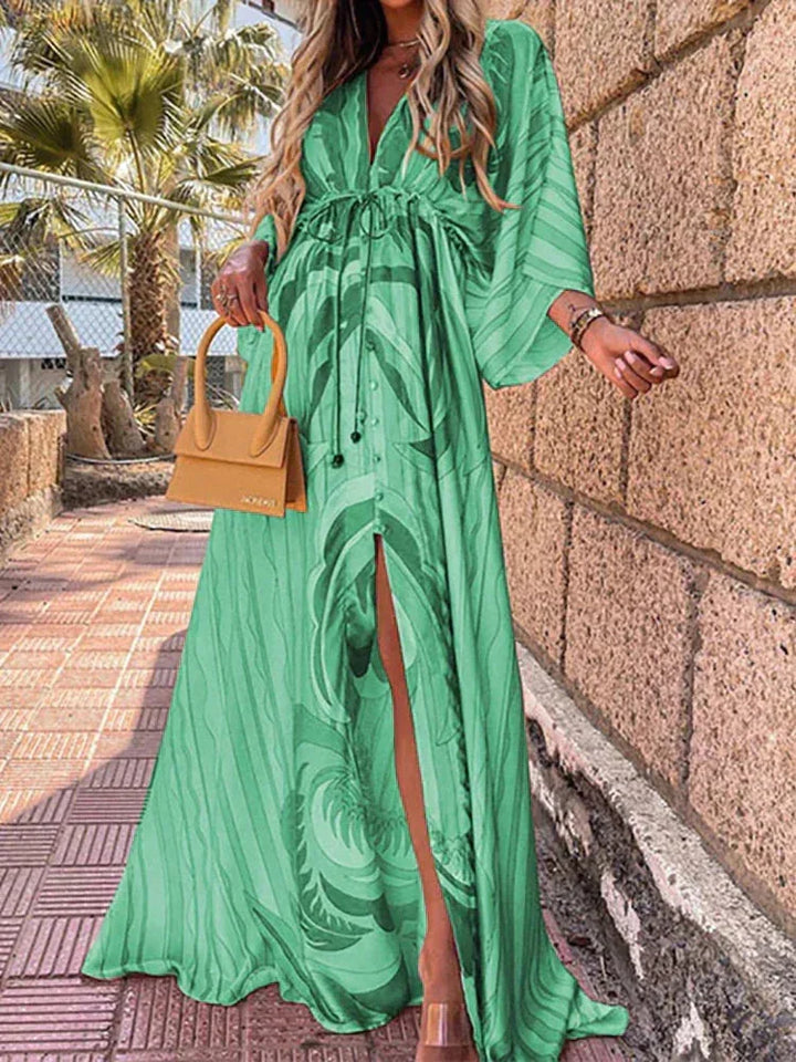 Green striped maxi dress with waist belt in soft cotton, perfect for casual outings or beach days. Features a flattering…