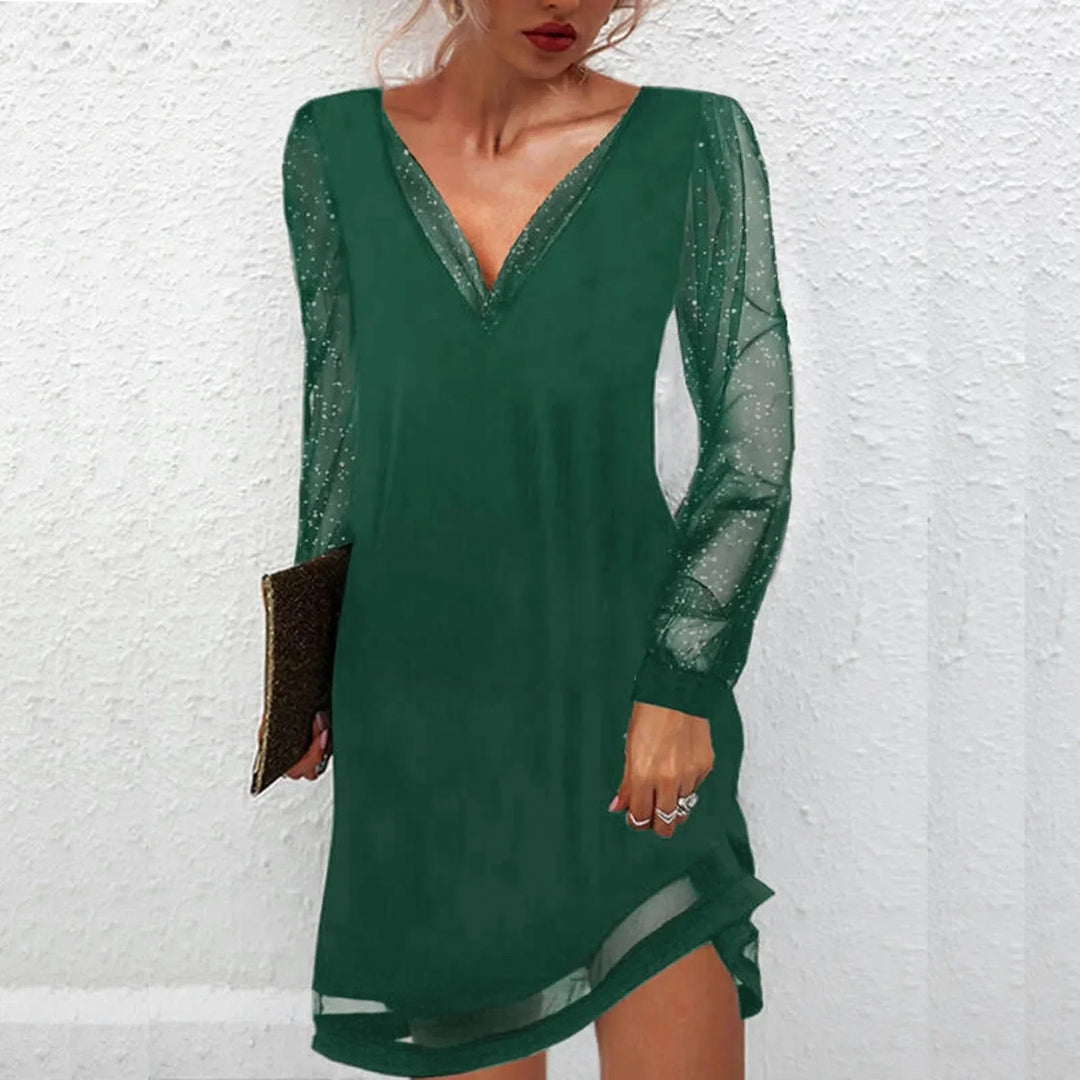 Green V-neck mini dress with sheer sleeves, perfect for a chic and elegant look. Made from high-quality fabric, ideal for…