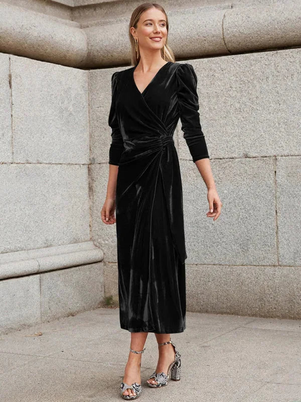 "Black velvet wrap dress with puffed sleeves, perfect for cocktail parties and dinners, adds elegance to your evening look."