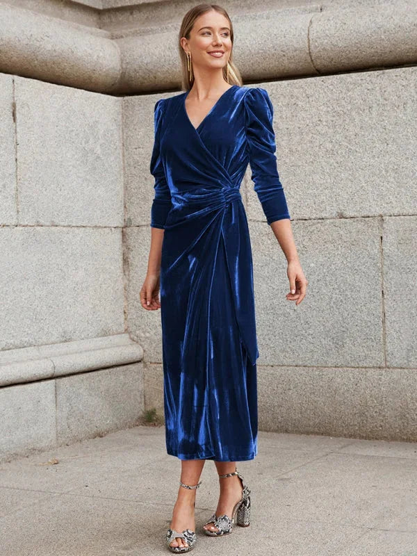 Velvet wrap dress with puffed sleeves, elegant and chic design, perfect for any occasion.