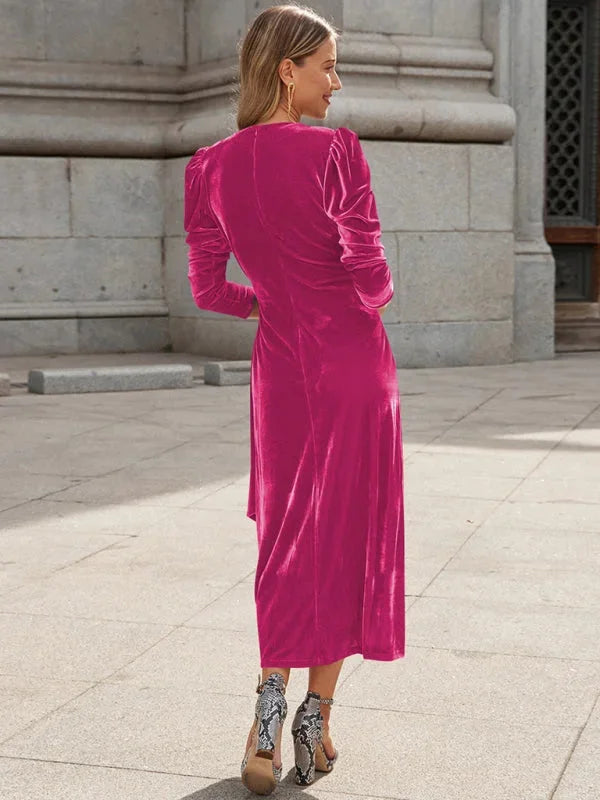 "Velvet wrap dress featuring chic puffed sleeves, perfect for an elegant evening look."