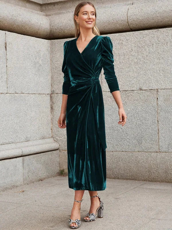 Velvet wrap dress in rich navy hue with statement puffed sleeves and a feminine silhouette by Novali.