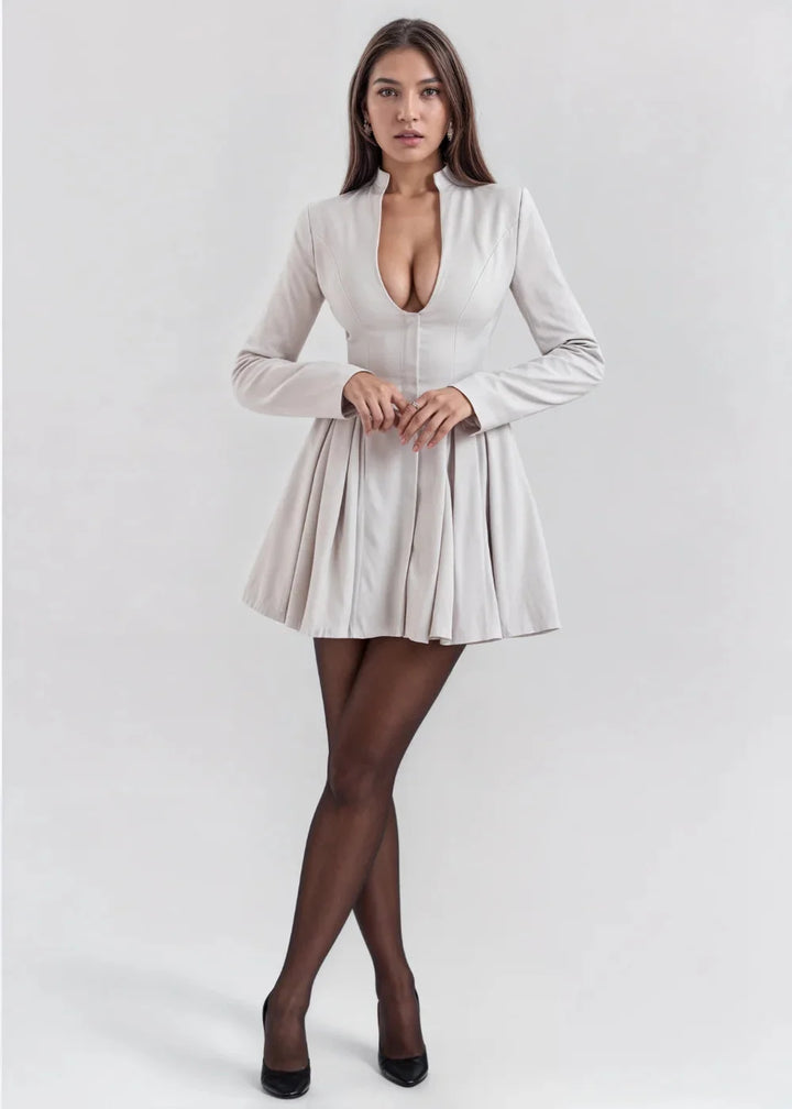 Grey mini dress with flared skirt and fitted bodice, made from soft and durable material, exuding a classic and chic look.