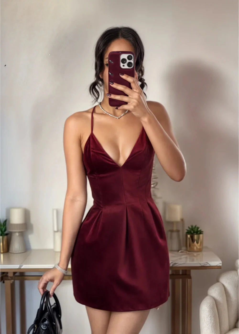 Burgundy velvet V-neck skater dress, a flattering silhouette for a stylish look.