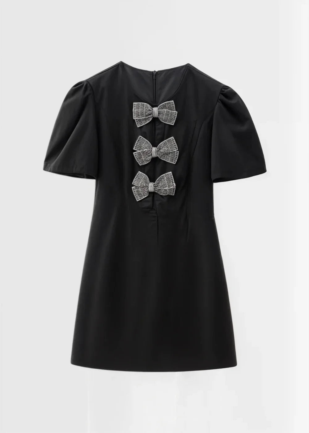 "Precious mini dress with puff sleeves and bows, made from soft and elegant fabric in a flattering A-line silhouette."