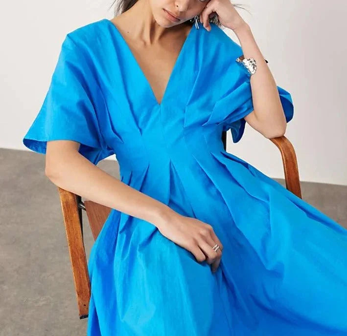 "Renlee V-neck dress in vibrant blue with kimono sleeves and midi length, perfect for a casual yet elegant look."