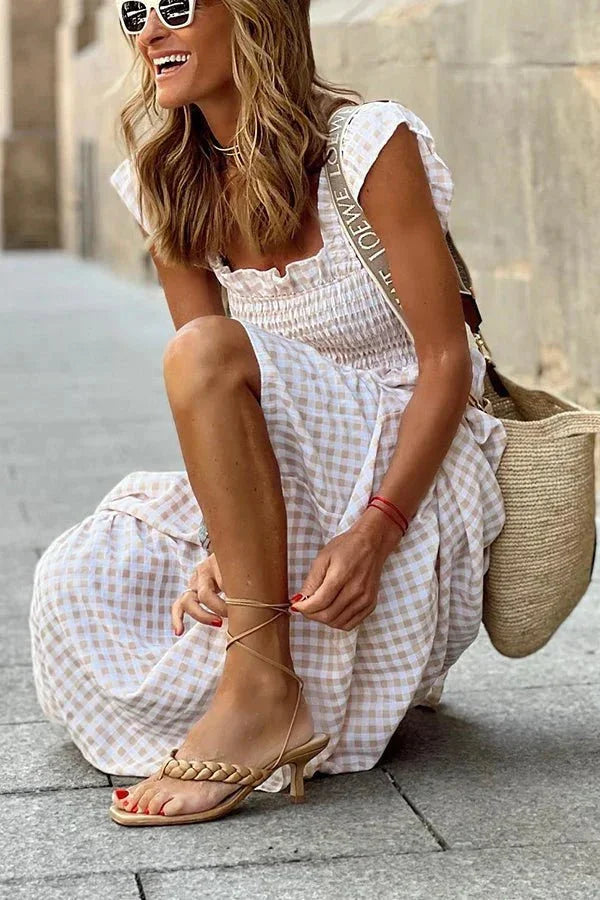 "Flowy maxi dress with ruffled cap sleeves, perfect for summer. Made of lightweight, breathable fabric in a relaxed fit."