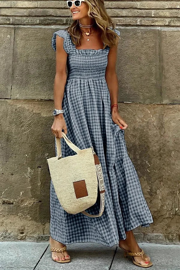 Dark blue ruffled cap sleeve maxi dress with a breezy design, perfect for a casual yet stylish look, made from lightweight…