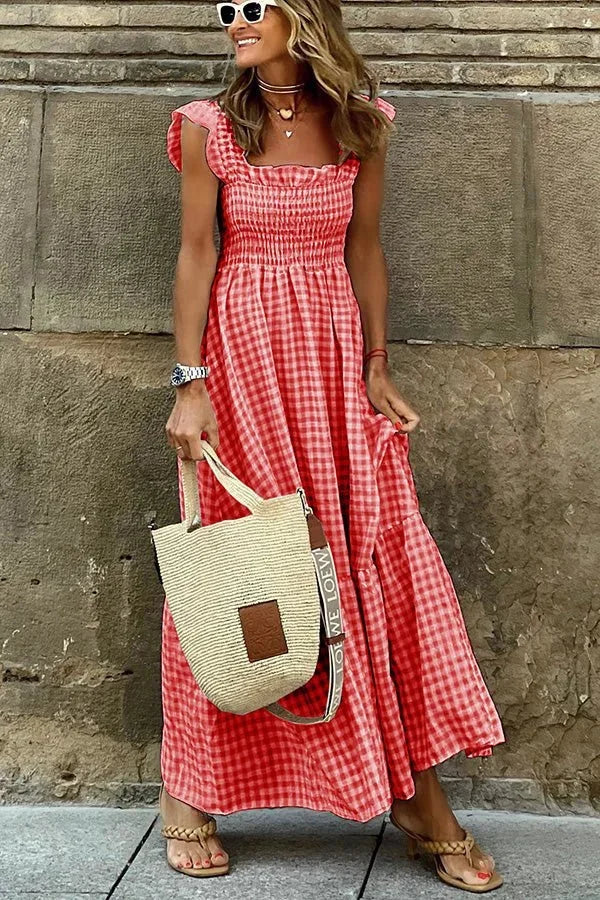 Red maxi dress with ruffled cap sleeves and a breezy design. Perfect for a casual yet stylish look.