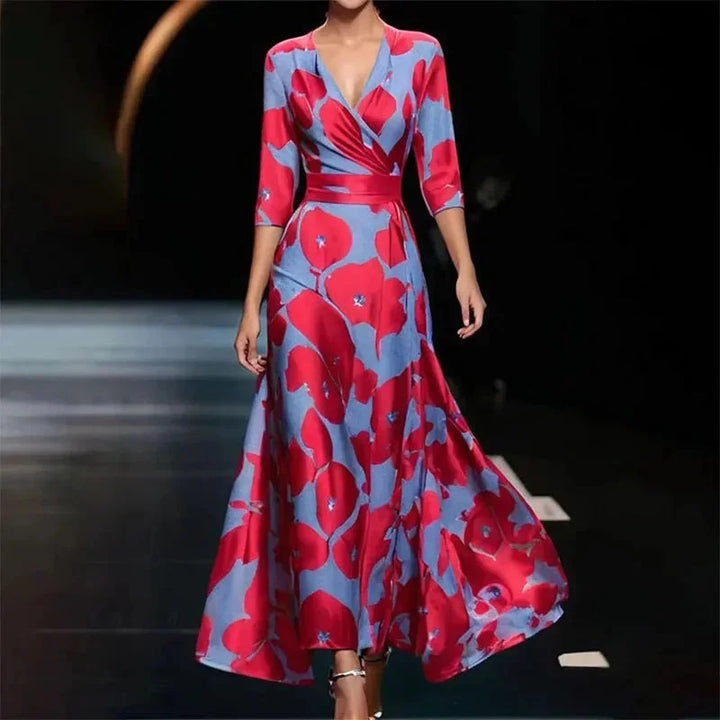 "Floral maxi dress with splits, featuring a belted waist, made from lightweight fabric in a stylish design."