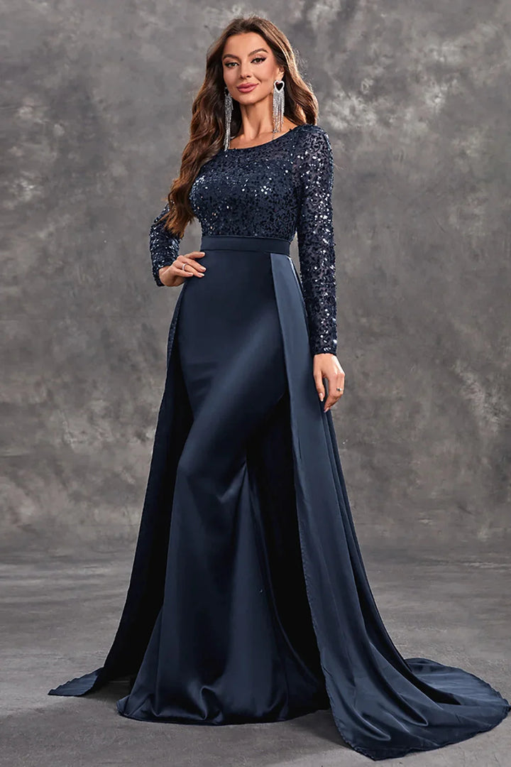 "Black evening dress with sequined bodice and flowy skirt, ideal for special occasions."