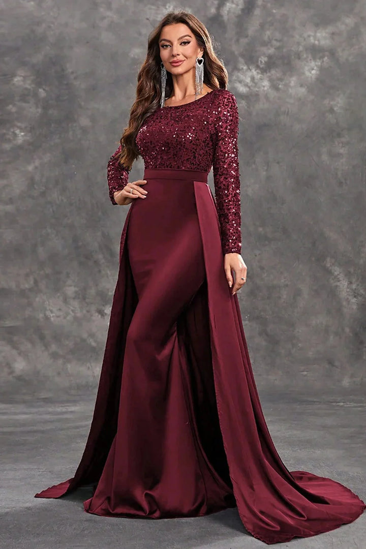 Sequined bodice evening dress featuring a flowing skirt, perfect for formal occasions or special events.