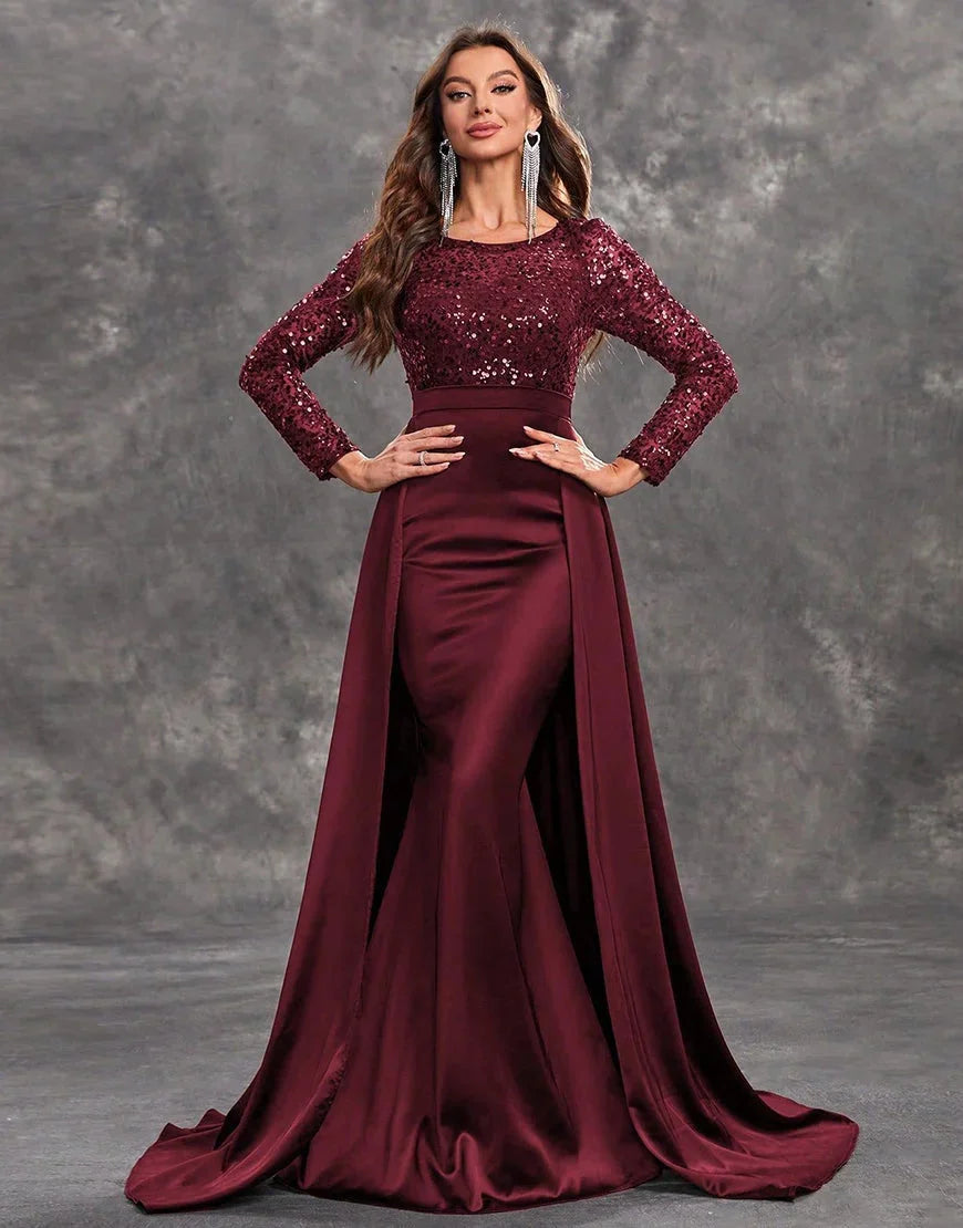 Burgundy evening dress with sequined bodice and flowing skirt, perfect for elegant occasions.