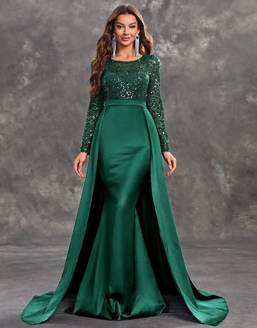 Green evening dress with sequined bodice and flowing skirt, perfect for special occasions.