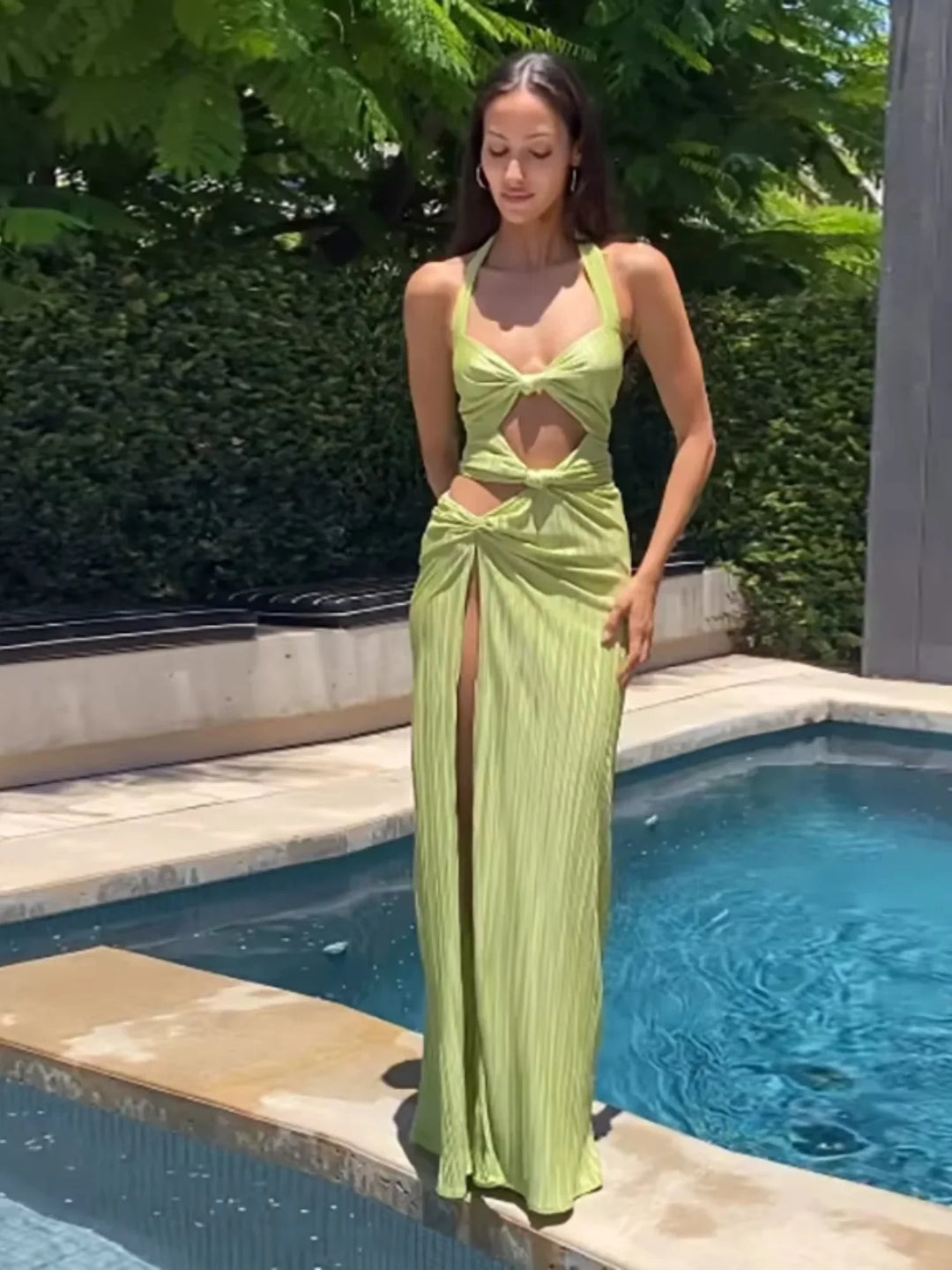 "Lime green maxi dress with side slit, elegant and flowy design, perfect for summer events."