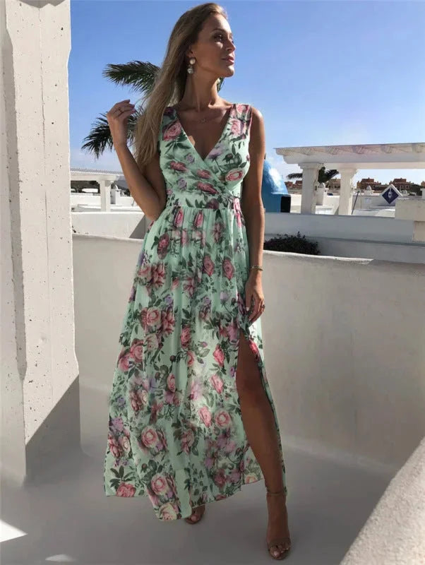 Sleeveless split-front floral maxi dress made from lightweight flowy fabric with vibrant floral pattern.