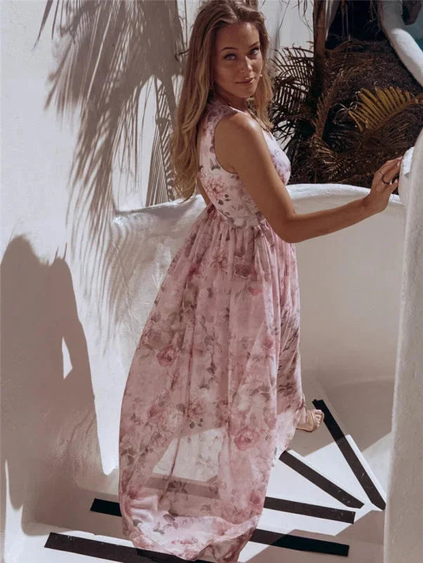 Sleeveless split-front maxi dress in floral print, made of lightweight flowy fabric for a breezy and chic summer look.