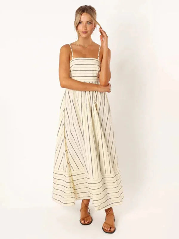 Airy striped maxi sundress in pastel colors with delicate straps perfect for sunny days.