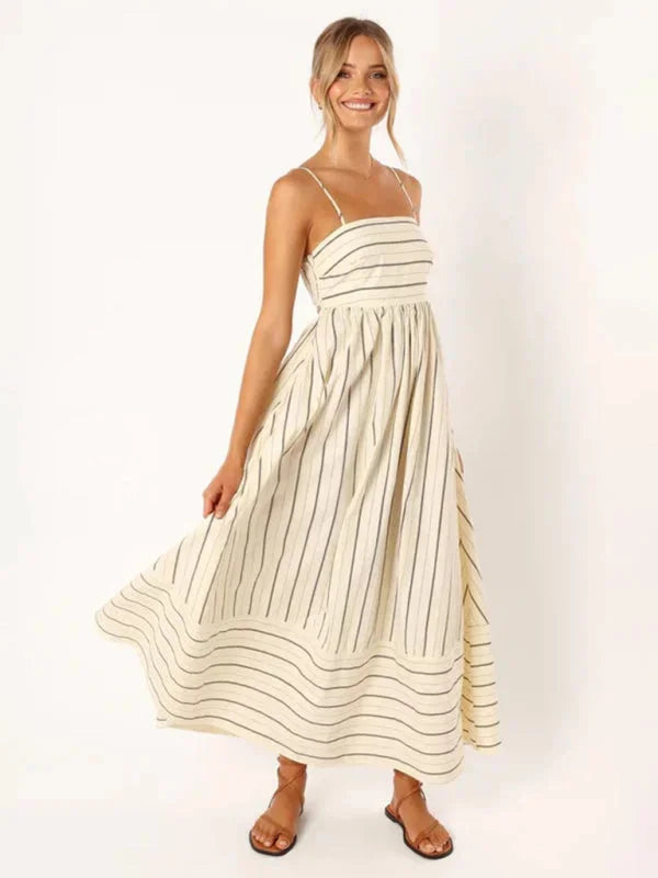 Striped maxi sundress in light fabric with delicate straps, perfect for sunny days.