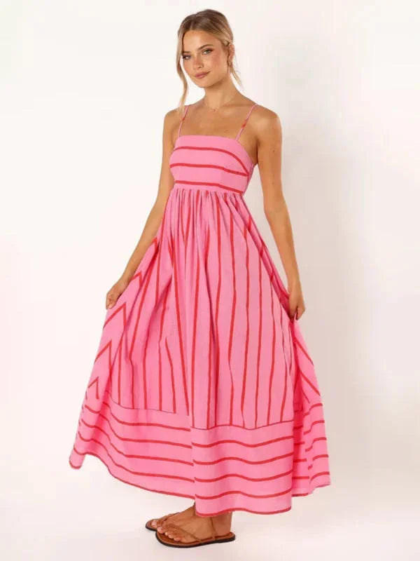 Striped maxi sundress with delicate straps in a breezy, airy fabric perfect for summer outings or beach days.