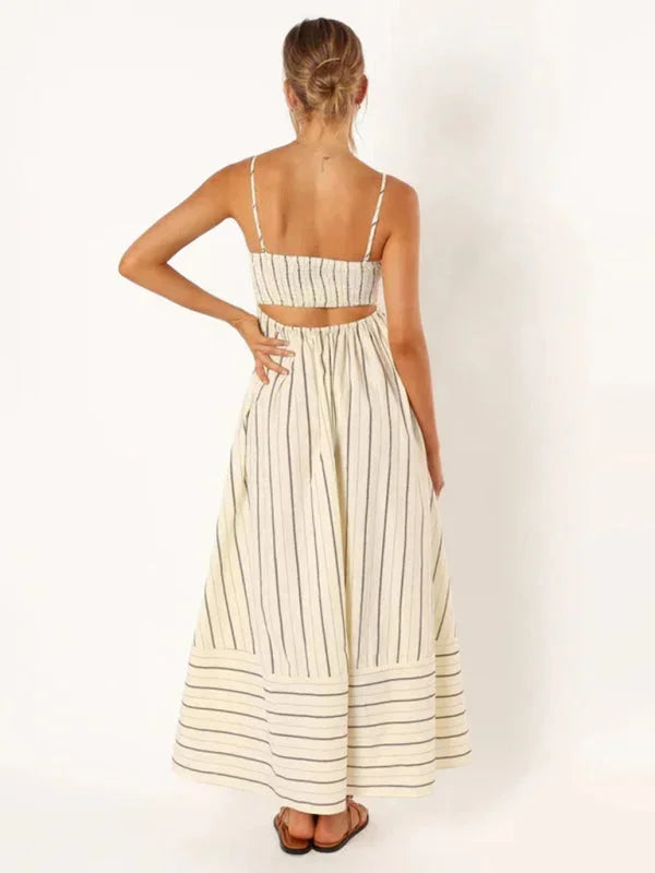 Striped maxi sundress in airy fabric with delicate straps, perfect for summer days.