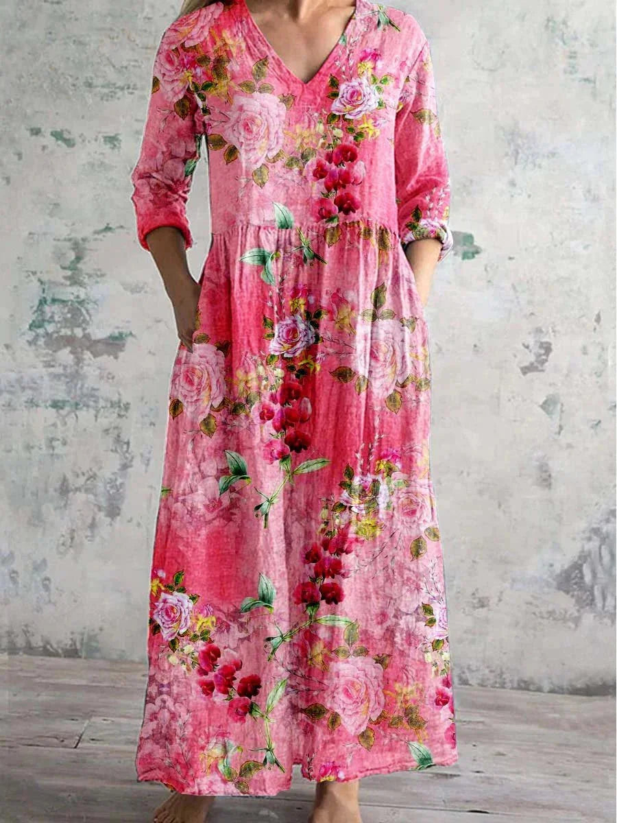 Pink V-neck maxi dress with floral print, perfect for summer days. Made of flowy fabric ideal for casual outings or dressy…