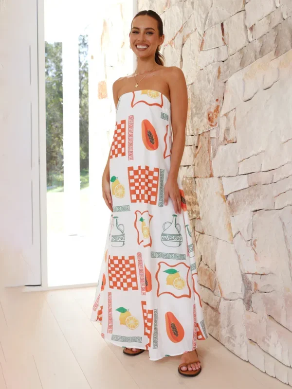 White strapless maxi dress with colorful prints. Flowy and vibrant summer essential.