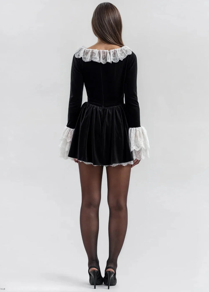 Black mini dress with voluminous lace sleeves, perfect for a chic and elegant look. Made from high-quality fabric with…