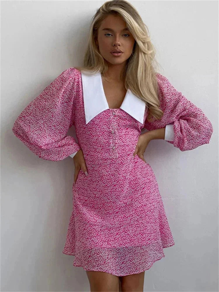 Pink puff sleeve dress with white collar, made of lightweight and breezy fabric. Features a chic and elegant design perfect…