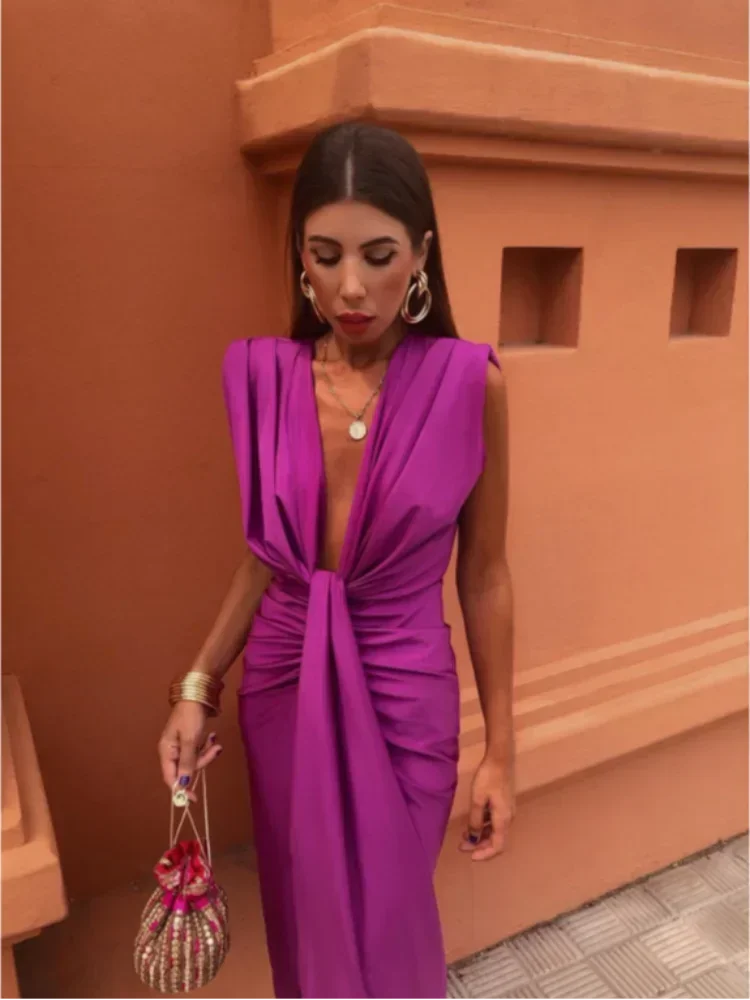 Fuchsia V-neck jumpsuit with pleats, elegant drape design in a comfortable fabric blend.