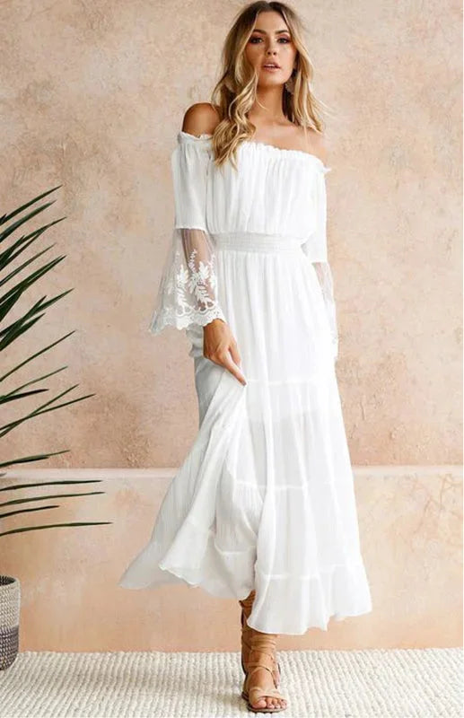 White off-shoulder tiered dress with lace sleeves, a perfect blend of elegance and femininity for a captivating summer look.