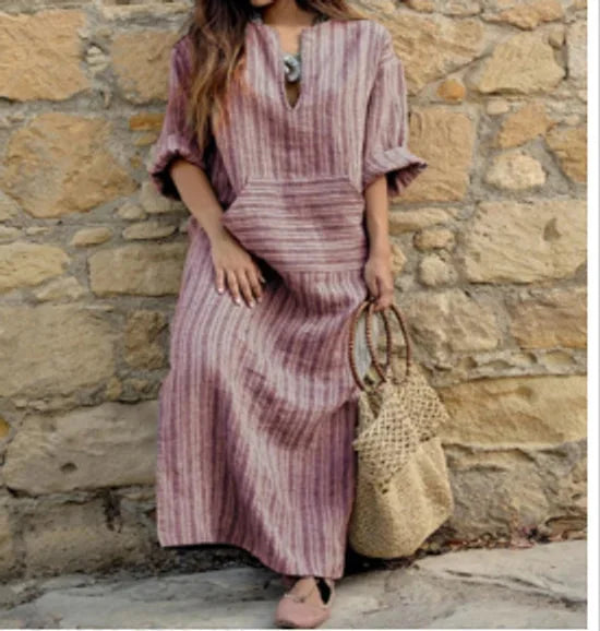 "Striped V-neck maxi dress in soft cotton blend with convenient pockets in Sierra collection by [brand]."