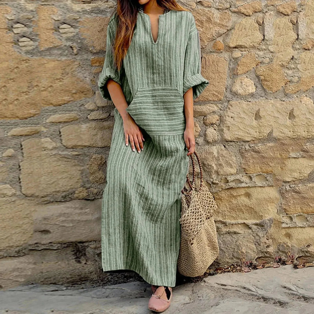 Green striped V-neck maxi dress with pockets made from soft, breathable fabric. Relax in style with this comfortable and…