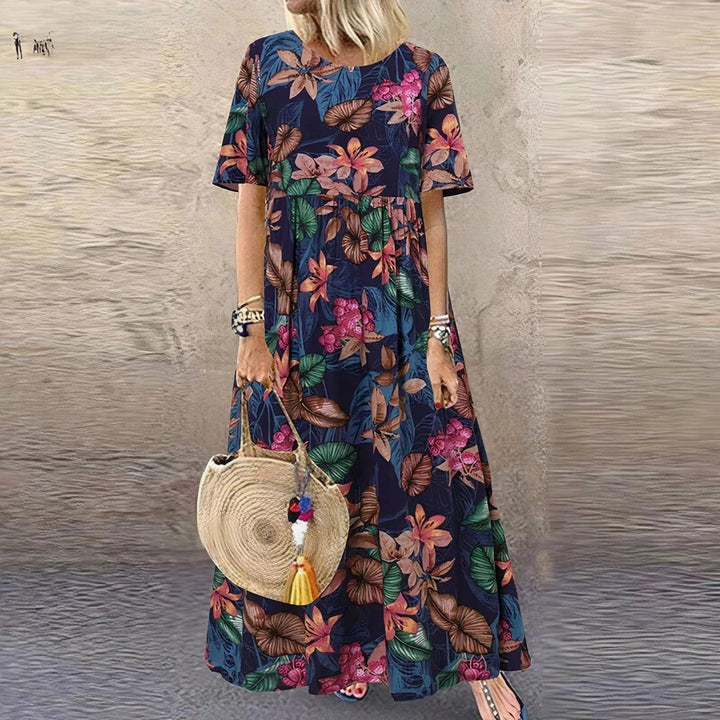 "Snow tiered maxi dress featuring a charming botanical print, perfect for a stylish and feminine look in the spring."