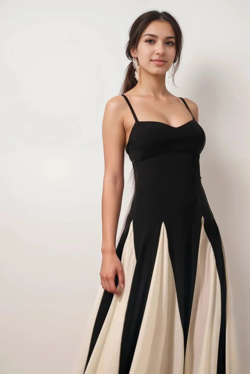 Black and cream panel dress with spaghetti straps, featuring a sleek and modern design.