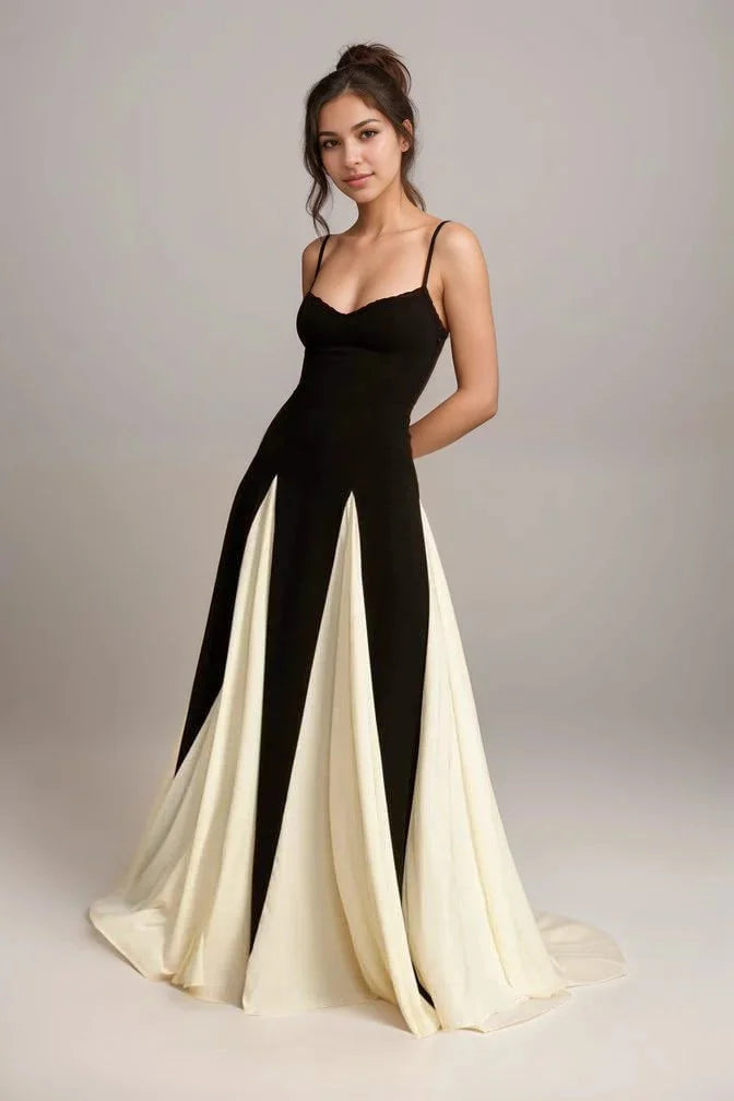 "Black and cream panel dress with spaghetti straps, stylish and versatile design."