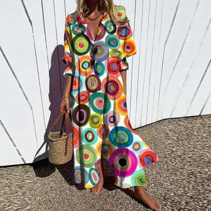 "Vibrant floral maxi dress with a V-neck and flowy sleeves, perfect for casual days or special occasions in a rainbow of…