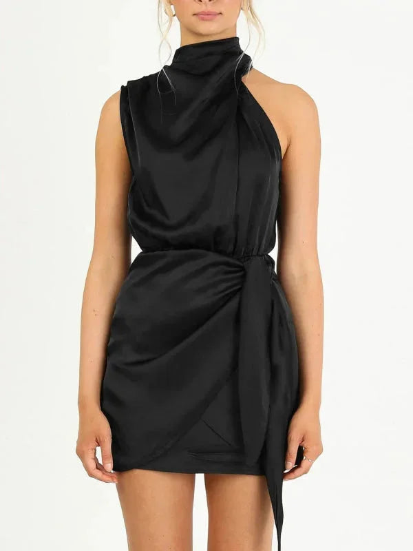 Black mini dress with cowl neck, perfect for any occasion. Soft and lightweight material with an elegant and feminine design.