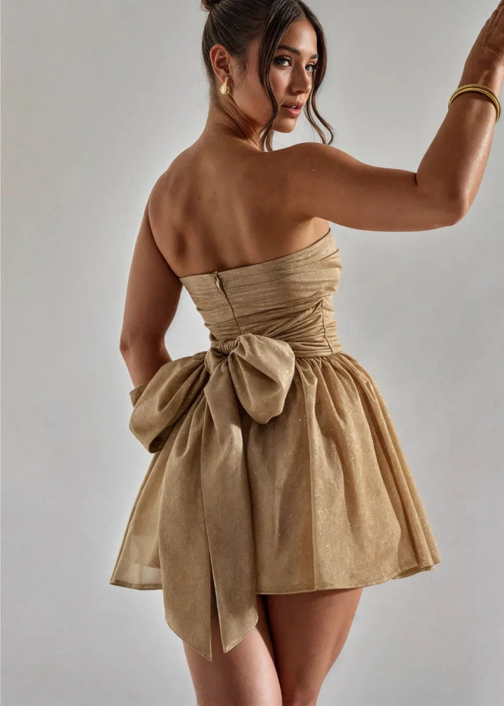 Strapless mini dress in sunshine yellow with elegant bow detail at the front. Ideal for summer outings and parties.